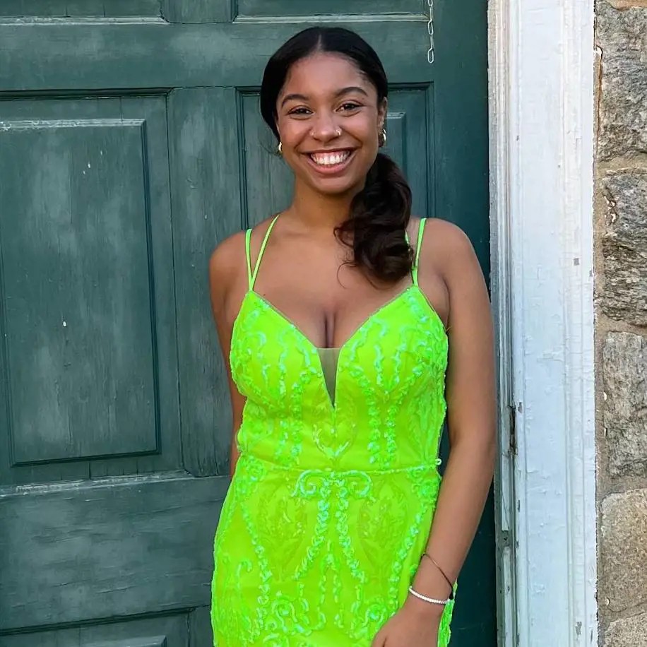 Model wearing a gown by Lailah